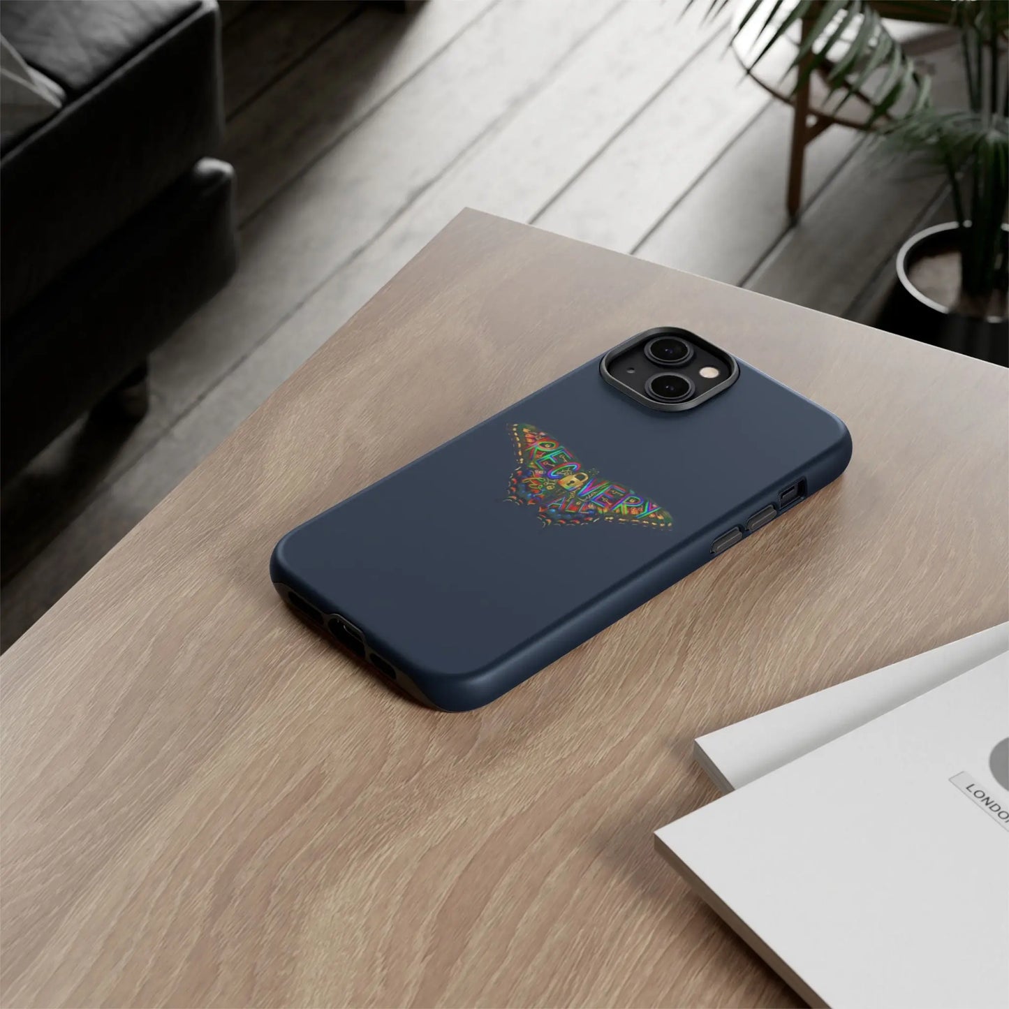 Blue phone case with a logo on a wooden table
