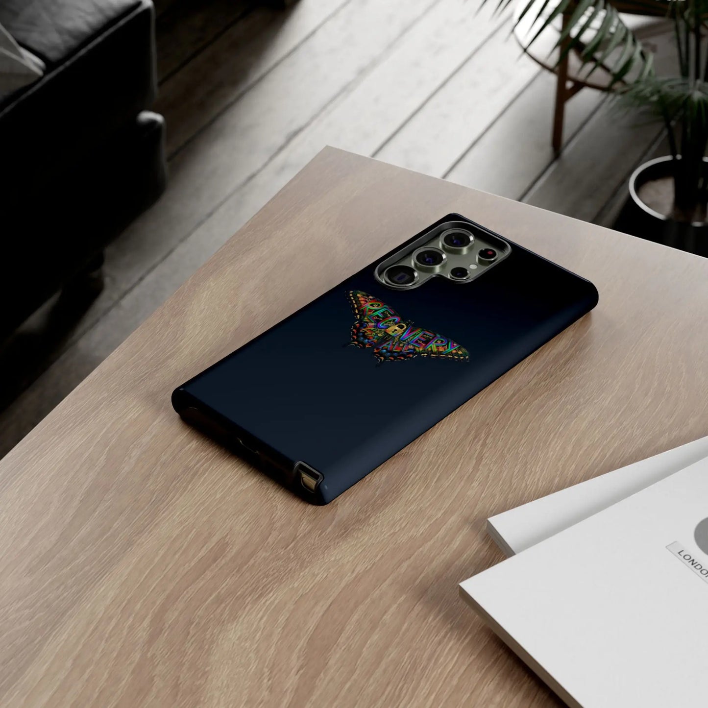 Phone case with Recovery Butterfly design on a wooden table
